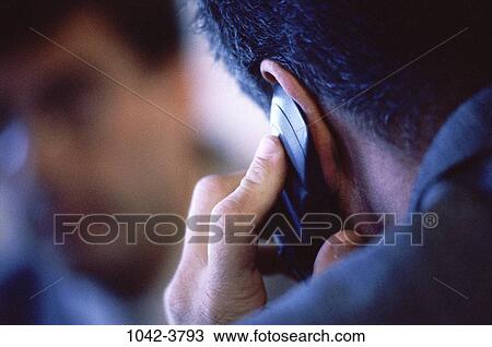 Stock Image - telephone, head, Hispanic, phone, business, outdoors. Fotosearch