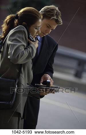 Stock Image - telephone, planner, talking, phone, business, outdoors, looking. Fotosearch