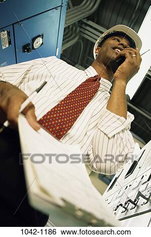 Stock Photograph - tie, pen, industry, construction, smiling, telephone. Fotosearch