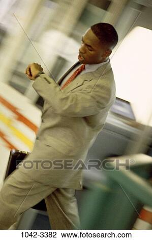 Stock Image - time, briefcase, rush, watch, business, outdoors. Fotosearch