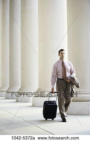 walking, luggage, business, outdoors, columns, pulling View Large Photo Image Stock Image - walking, luggage, business, outdoors, columns, pulling. Fotosearch