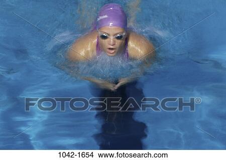 water, pool, woman, Hispanic, swimming, concentrating, sports View Large Photo Image Picture - water, pool, woman, Hispanic, swimming, concentrating, sports. Fotosearch