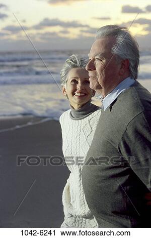water, smiling, walking, staring, couple, senior, evening View Large Photo Image Stock Image - water, smiling, walking, staring, couple, senior, evening. Fotosearch