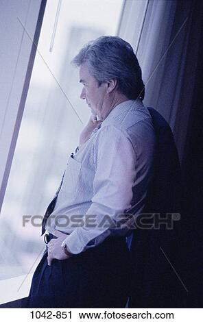 Stock Image - window, business, Middle-aged, contemplation, contemplating, businessman. Fotosearch