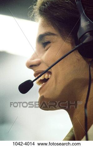 Picture - woman, headset, Hispanic, business, concepts, joyous, microphone. Fotosearch