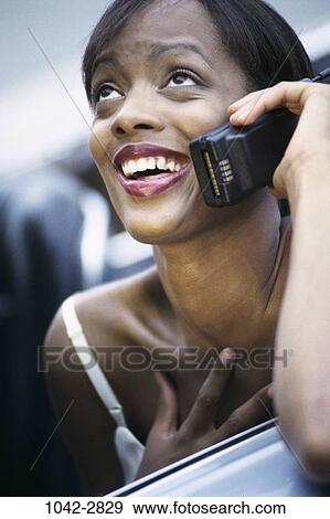 woman, smiling, telephone, talking, phone, outdoors, surprised View Large Photo Image Stock Photo - woman, smiling, telephone, talking, phone, outdoors, surprised. Fotosearch