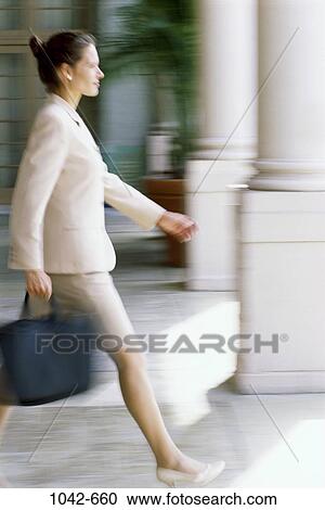 woman, walking, briefcase, rush, business, outdoors, serious View Large Photo Image Stock Image - woman, walking, briefcase, rush, business, outdoors, serious. Fotosearch