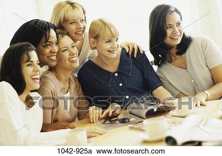 women, people, smiling, table, sitting, magazine View Large Photo Image Stock Image - women, people, smiling, table, sitting, magazine. Fotosearch