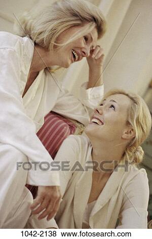 women, people, talking, conversation, mother, laughing, couch View Large Photo Image Stock Photo - women, people, talking, conversation, mother, laughing, couch. Fotosearch