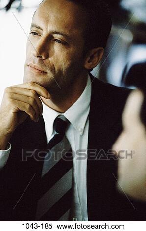 Stock Photography - business, contemplation, contemplating, businessman, indoors, contemplate. Fotosearch