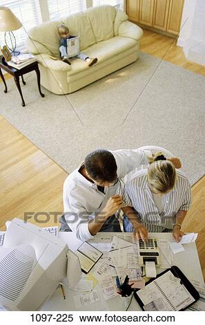 Stock Photography - calculator, lifestyles, challenges, anticipation, beginnings, personal finance, calculating. Fotosearch