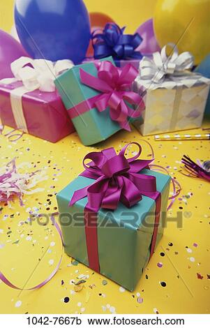 Stock Image - , celebration, wrapped, balloons, festive, confetti, streamers. Fotosearch