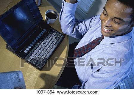computer, laptop, business, businessman, African-American View Large Photo Image Picture - computer, laptop, business, businessman, African-American. Fotosearch