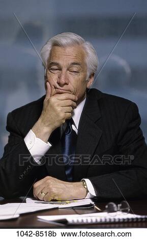 Stock Image - desk, business, businessman, indoors, Businessmen indoors desk. Fotosearch