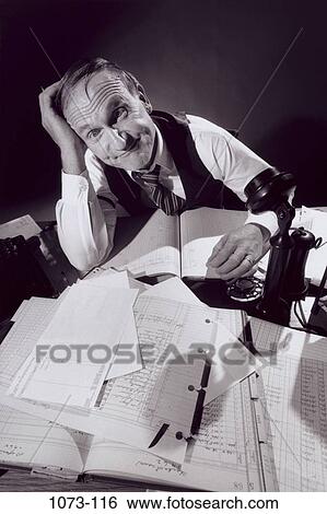 desk, busy, senior, papers, overwhelmed, stress View Large Photo Image Stock Photograph - desk, busy, senior, papers, overwhelmed, stress. Fotosearch