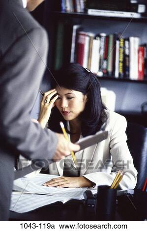 desk, paperwork, Asian, papers, stress, business, frustrated View Large Photo Image Stock Image - desk, paperwork, Asian, papers, stress, business, frustrated. Fotosearch