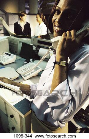 desk, woman, smiling, telephone, listening, phone, business View Large Photo Image Picture - desk, woman, smiling, telephone, listening, phone, business. Fotosearch