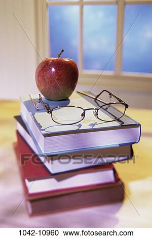 eyeglasses, books, apple, school, stacked, education, learning View Large Photo Image Stock Image - eyeglasses, books, apple, school, stacked, education, learning. Fotosearch