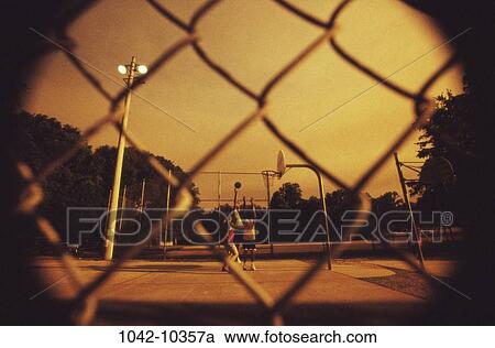 fence, men, people, evening, outdoors, court View Large Photo Image Stock Image - fence, men, people, evening, outdoors, court. Fotosearch