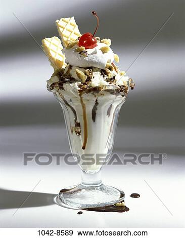 Stock Photo - glass, cherry, ice cream, sundae, food, dairy, indulgence. Fotosearch