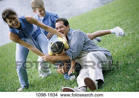 grass, people, playing, laughing, outdoors, family, play View Large Photo Image Picture - grass, people, playing, laughing, outdoors, family, play. Fotosearch
