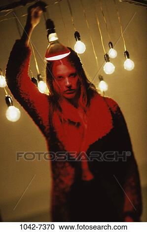 light, woman, coat, holding, serious, hold View Large Photo Image Stock Image - light, woman, coat, holding, serious, hold. Fotosearch