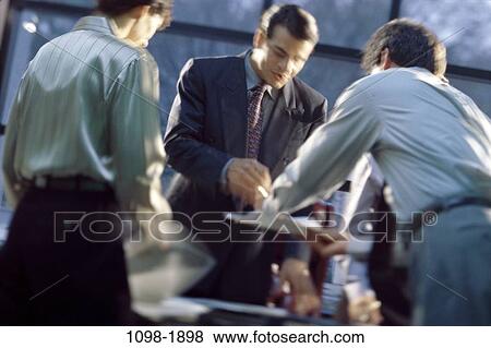meeting, desk, paperwork, discussion, papers, motion View Large Photo Image Stock Photo - meeting, desk, paperwork, discussion, papers, motion. Fotosearch