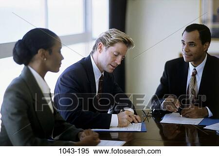 Stock Photography - meeting, group, multiethnic, signing, business, writing. Fotosearch