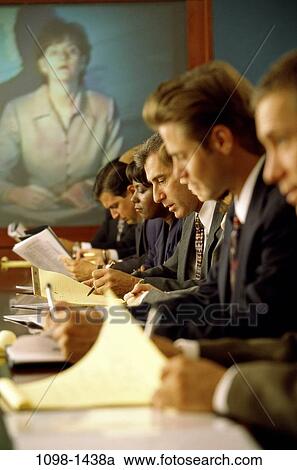 Stock Image - meeting, group, multiethnic, technology, concentration, communications, business. Fotosearch