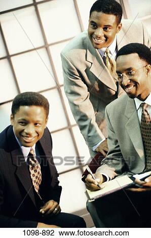 meeting, men, smiling, business, businessmen, indoors, trio View Large Photo Image Stock Image - meeting, men, smiling, business, businessmen, indoors, trio. Fotosearch