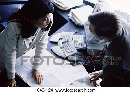 meeting, multiethnic, overhead, desk, paperwork, discussion View Large Photo Image Picture - meeting, multiethnic, overhead, desk, paperwork, discussion. Fotosearch