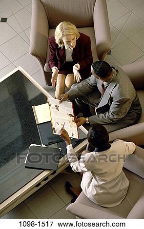 meeting, multiethnic, overhead, discussion, business, Middle-aged, explaining View Large Photo Image Stock Photo - meeting, multiethnic, overhead, discussion, business, Middle-aged, explaining. Fotosearch