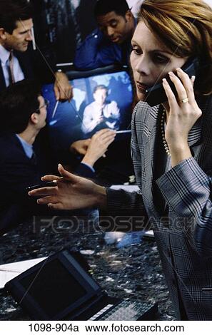 Stock Image - meeting, multiethnic, telephone, laptop, phone, communications, business. Fotosearch
