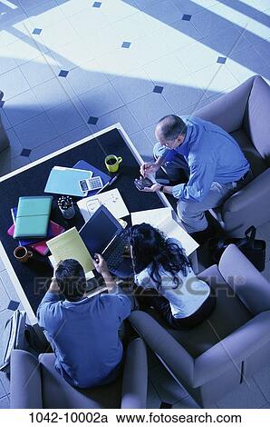 meeting, people, table, calculator, consultation, paperwork, computer View Large Photo Image Stock Image - meeting, people, table, calculator, consultation, paperwork, computer. Fotosearch