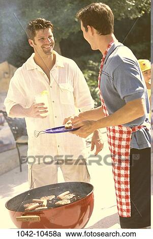 men, glass, talking, cooking, picnic, holding, standing View Large Photo Image Stock Image - men, glass, talking, cooking, picnic, holding, standing. Fotosearch