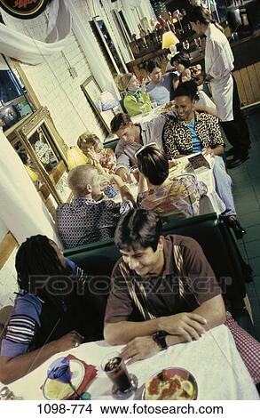 multiethnic, groups, people, restaurant, tables, indoors View Large Photo Image Picture - multiethnic, groups, people, restaurant, tables, indoors. Fotosearch