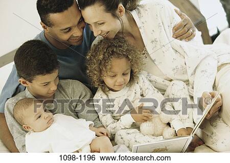 multiethnic, people, reading, book, family, children View Large Photo Image Stock Photograph - multiethnic, people, reading, book, family, children. Fotosearch