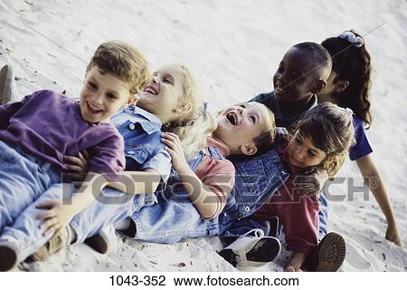 multiethnic, people, smiling, playing, laughing, laid back View Large Photo Image Stock Image - multiethnic, people, smiling, playing, laughing, laid back. Fotosearch