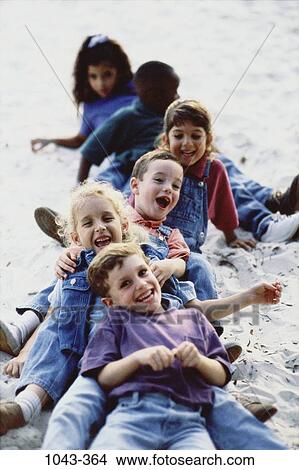 multiethnic, sand, people, beach, laughing, playful, emotions View Large Photo Image Picture - multiethnic, sand, people, beach, laughing, playful, emotions. Fotosearch