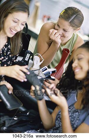 multiethnic, women, people, shoe, laughing, holding, looking View Large Photo Image Stock Image - multiethnic, women, people, shoe, laughing, holding, looking. Fotosearch