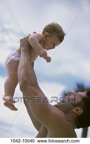 overhead, people, playing, baby, holding, playful, outdoors View Large Photo Image Stock Image - overhead, people, playing, baby, holding, playful, outdoors. Fotosearch