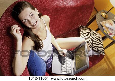 overhead, people, relaxation, woman, smiling, sitting, computer View Large Photo Image Picture - overhead, people, relaxation, woman, smiling, sitting, computer. Fotosearch