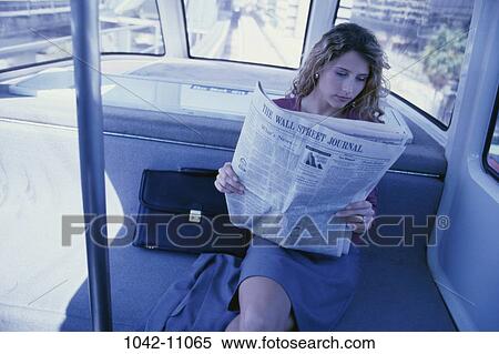 paper, woman, newspaper, briefcase, reading, riding, business View Large Photo Image Stock Photography - paper, woman, newspaper, briefcase, reading, riding, business. Fotosearch