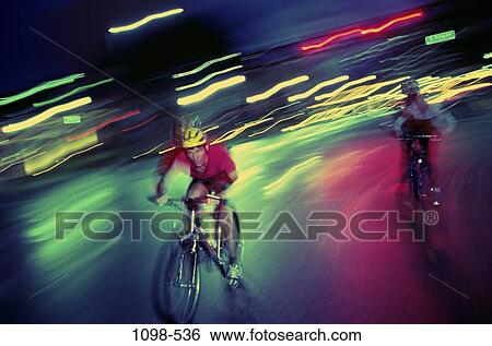 Stock Photograph - people, blur, racing, bicycle, motion, street, sports. Fotosearch