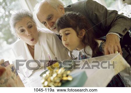 people, cake, lifestyles, holidays, dining out, blowing, gift View Large Photo Image Stock Image - people, cake, lifestyles, holidays, dining out, blowing, gift. Fotosearch