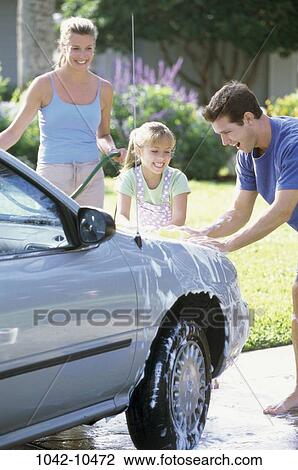 Stock Image - people, car, outdoors, teamwork, family, daughter, washing. Fotosearch