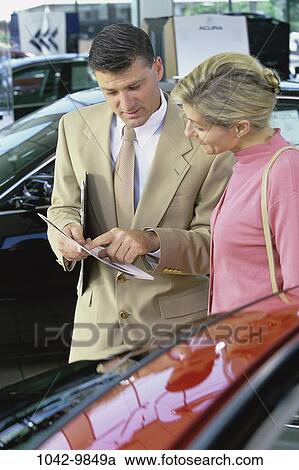 people, car, reading, Middle-aged, shopping, salesman, shop View Large Photo Image Stock Image - people, car, reading, Middle-aged, shopping, salesman, shop. Fotosearch