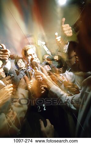 Picture - people, chaotic, surrounding, microphones, interview, chaos. Fotosearch