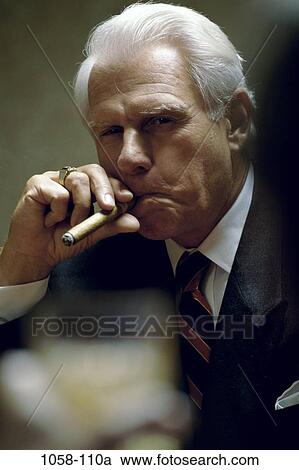 Stock Image - people, cigar, smoke, senior, holding, smoking. Fotosearch