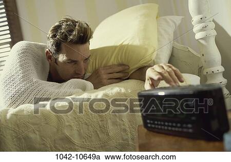 people, clock, bed, blond, reaching View Large Photo Image Stock Image - people, clock, bed, blond, reaching. Fotosearch